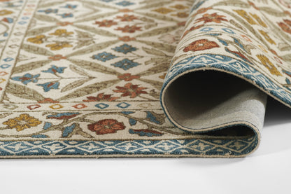 Traditional blue and ivory wool rug with geometric floral motifs, rolled edge, decorative floor covering.