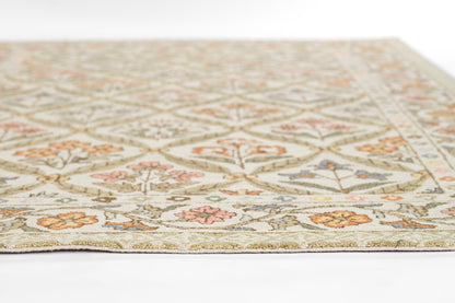 Cream oriental-style area rug with diamond lattice and floral motifs in sage green, peach, pink and blue.