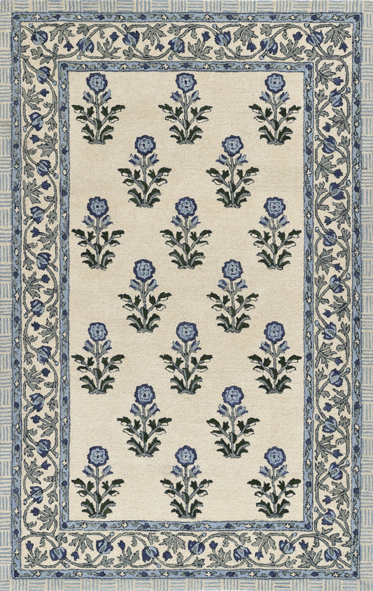 Cream field blue floral area rug with repeating blue blossoms and green stems; framed by decorative blue borders.