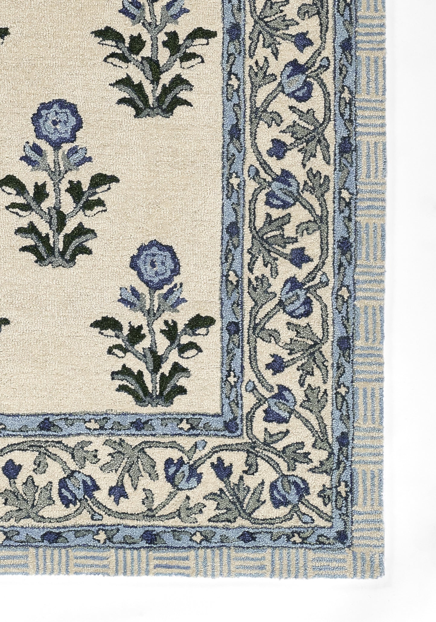 Cream rug with blue floral motifs and a scrolling blue border in a traditional pattern.