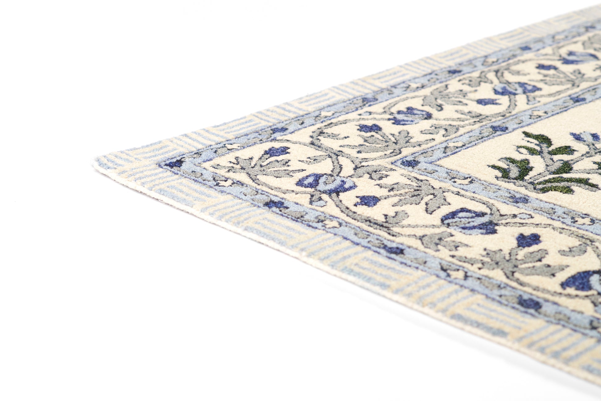 Cream rug with blue floral border & fringe edges, woven texture; Persian/Oriental style for living room decor.