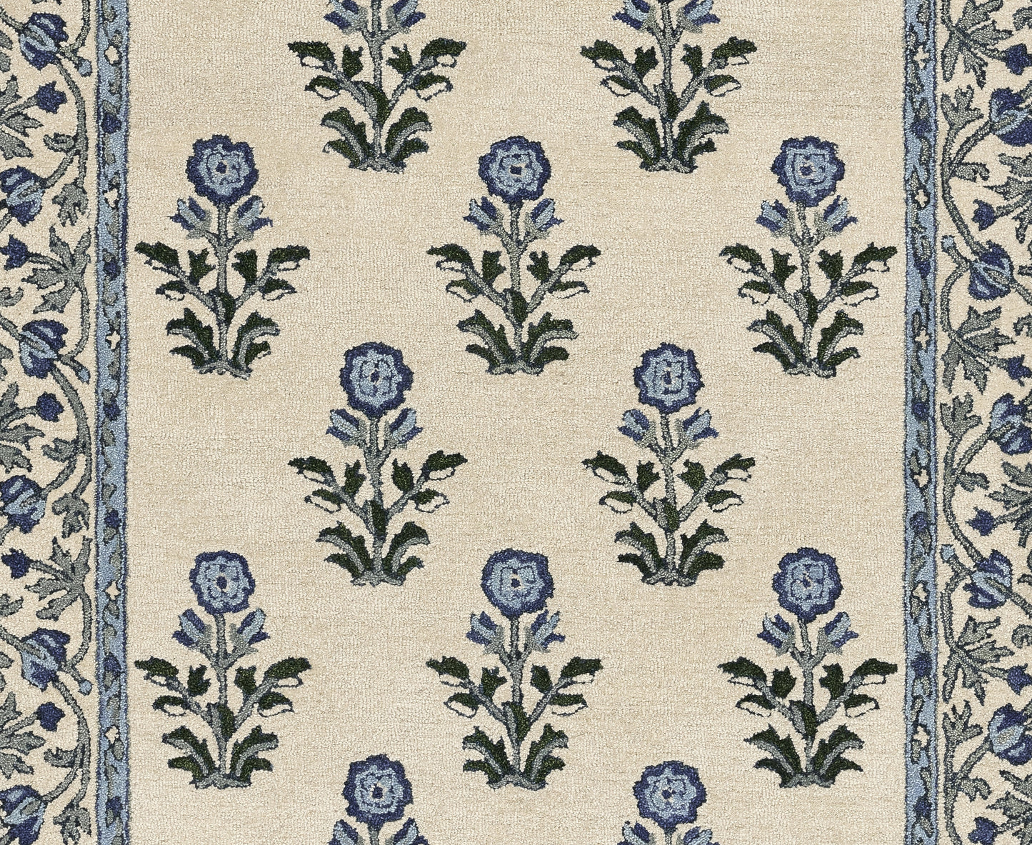 Beige fabric with repeating blue flowers and green leaves on cream, framed by narrow blue floral borders along sides.