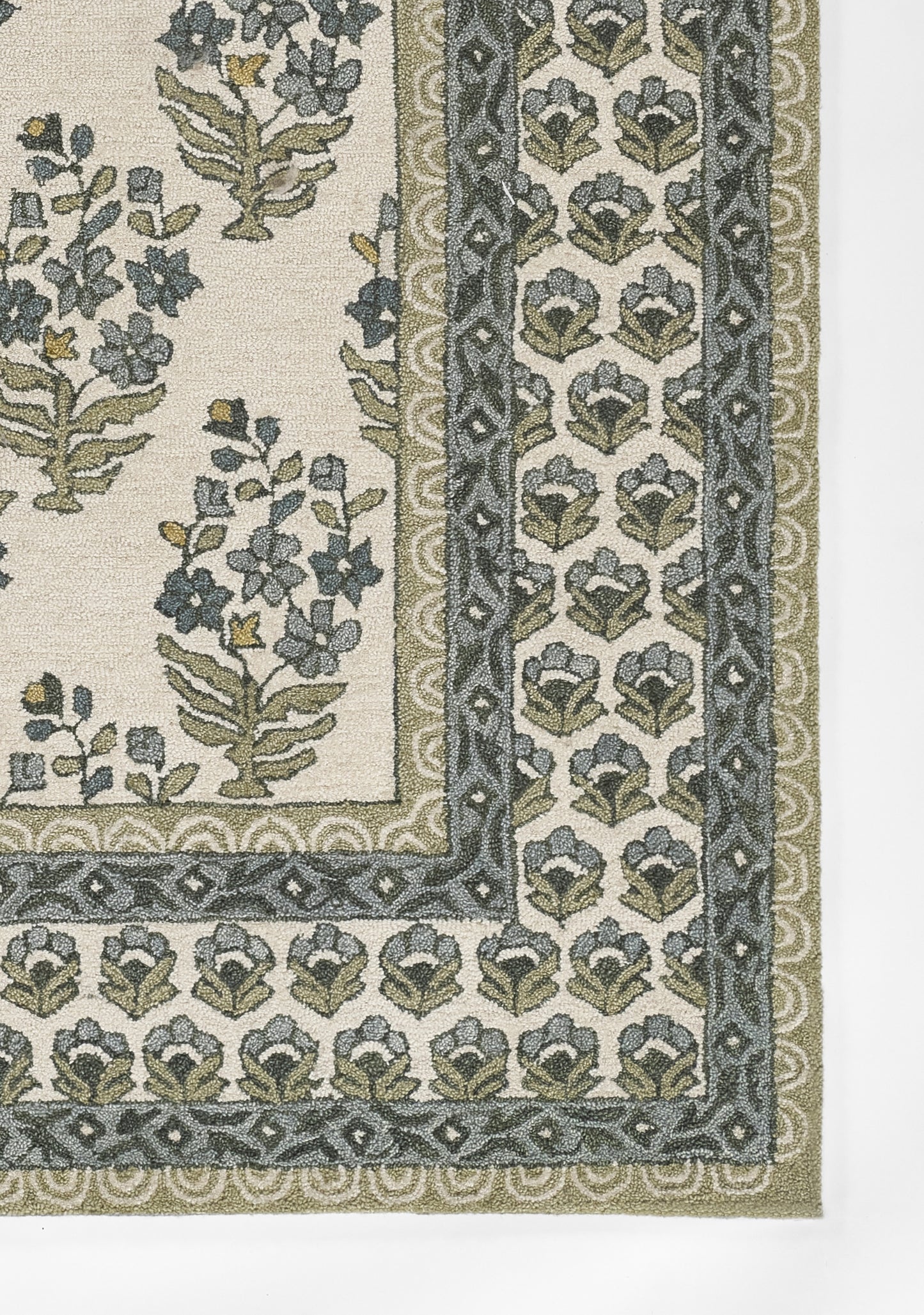 Green botanical rug with ivory field and double blue-green borders, classic floral vine motif.