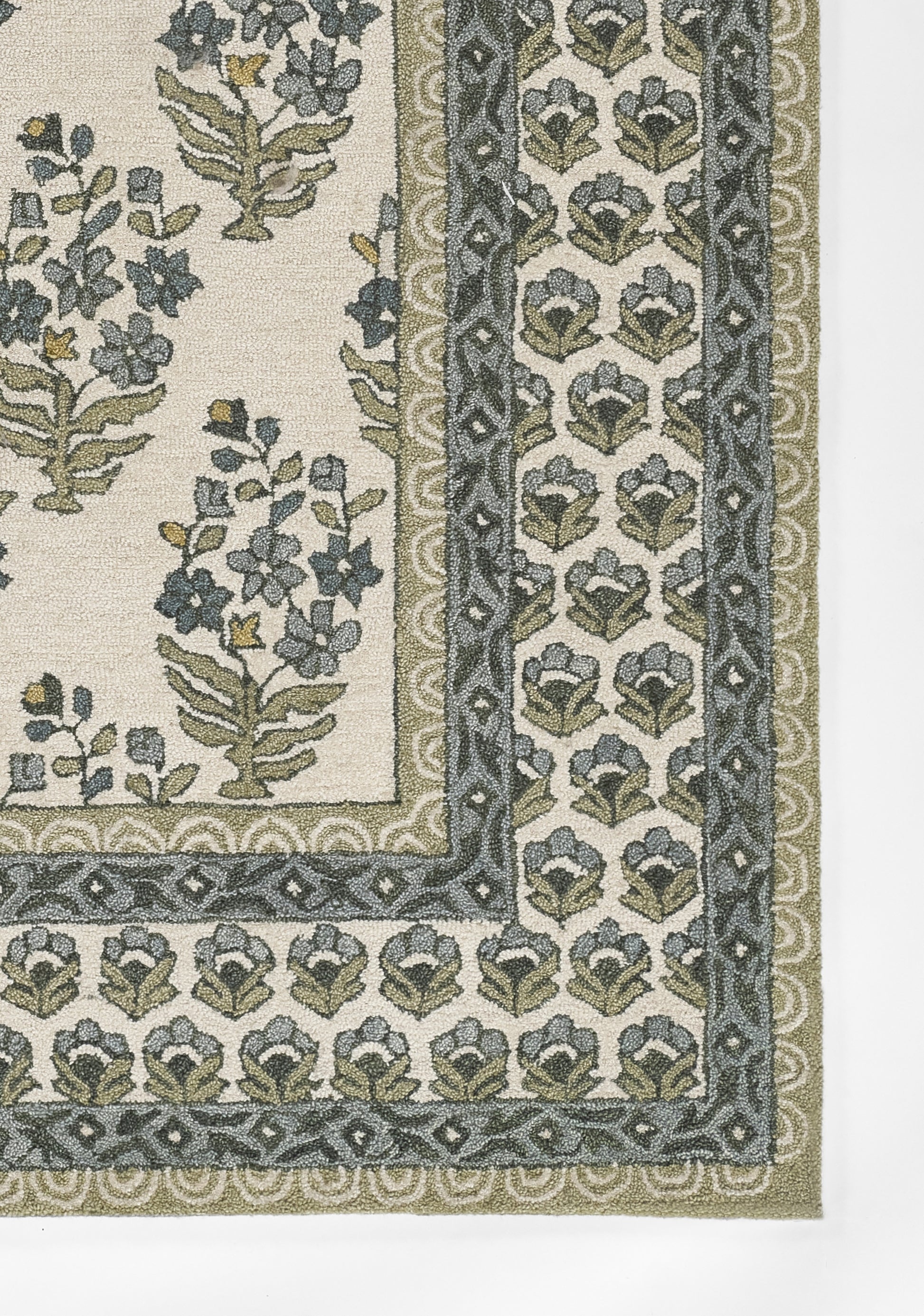 Green botanical rug with ivory field and double blue-green borders, classic floral vine motif.