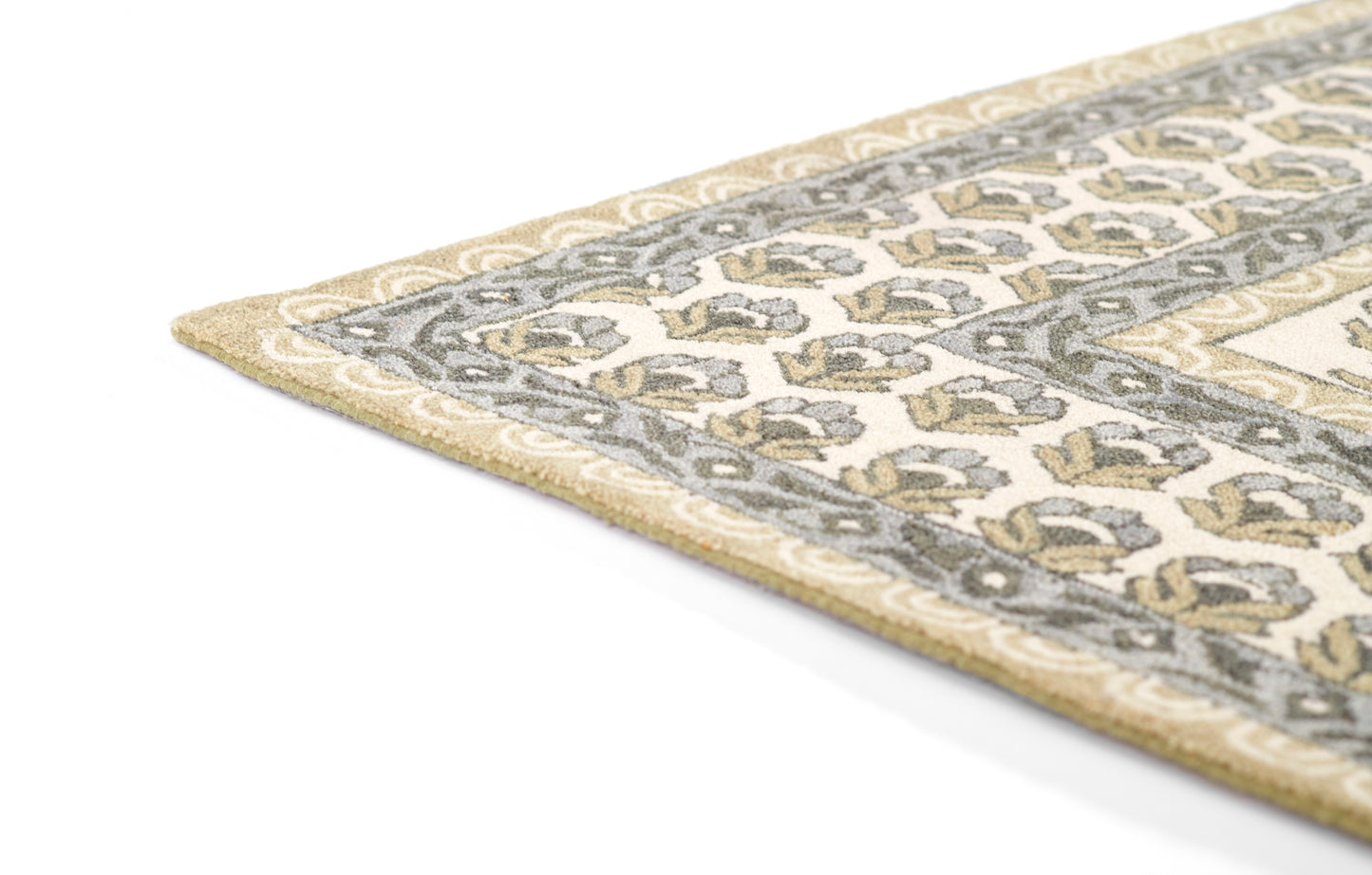 Corner view of a beige woven rug with a grey floral border and subtle leaf pattern, classic decorative style.