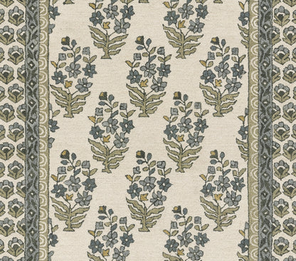 Cream fabric with blue-green floral sprigs and bordered scroll motifs; vintage botanical pattern.