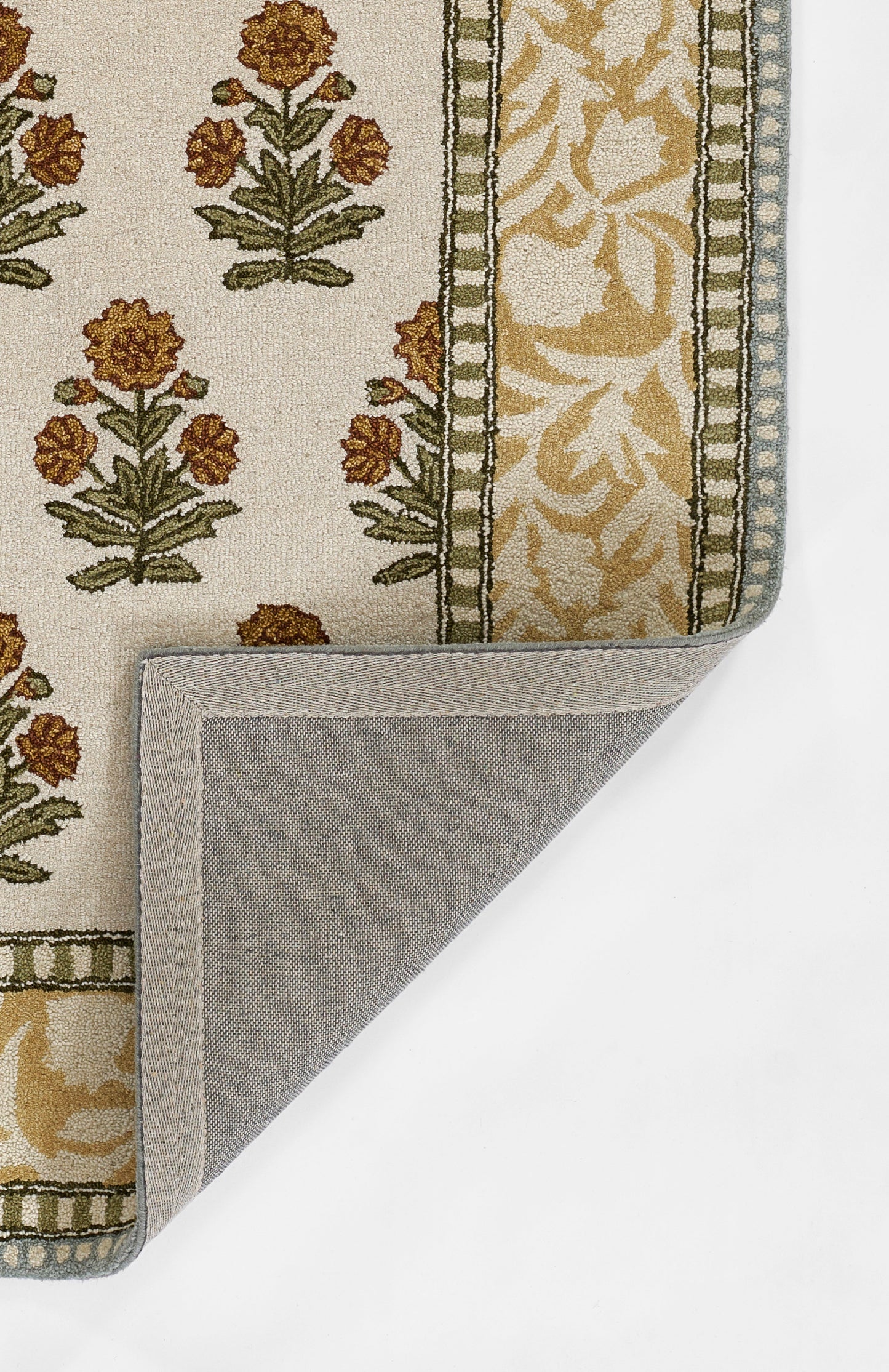 Beige Cotswold-style runner rug with gold floral motifs and olive-green border; folded corner reveals grey back.