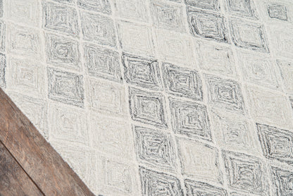 Light gray geometric rug with diamond motif.