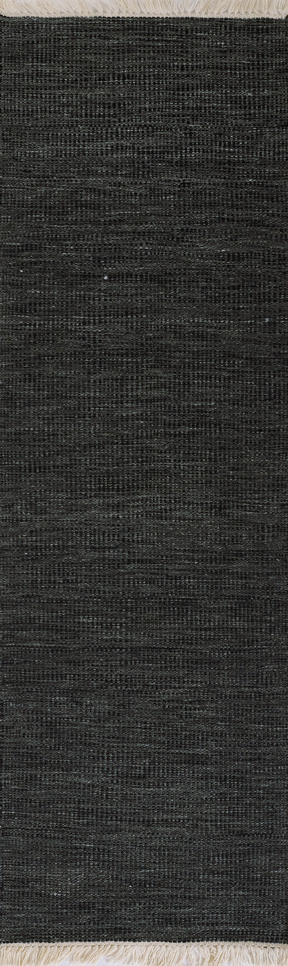 Dark charcoal woven fabric close-up with fine linear texture, ideal for upholstery or drapery.