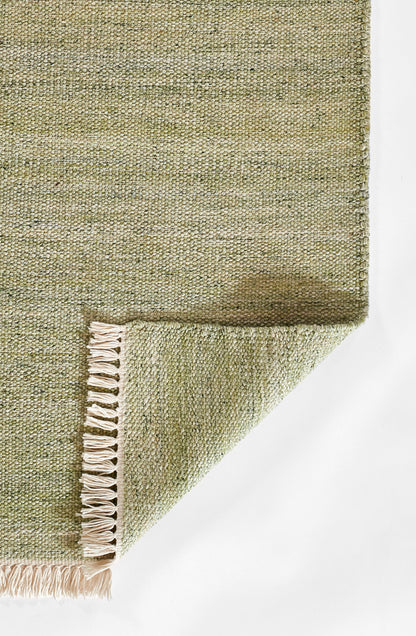 Olive-green woven runner with beige fringe along one edge; rectangular boho-style runner for living spaces.