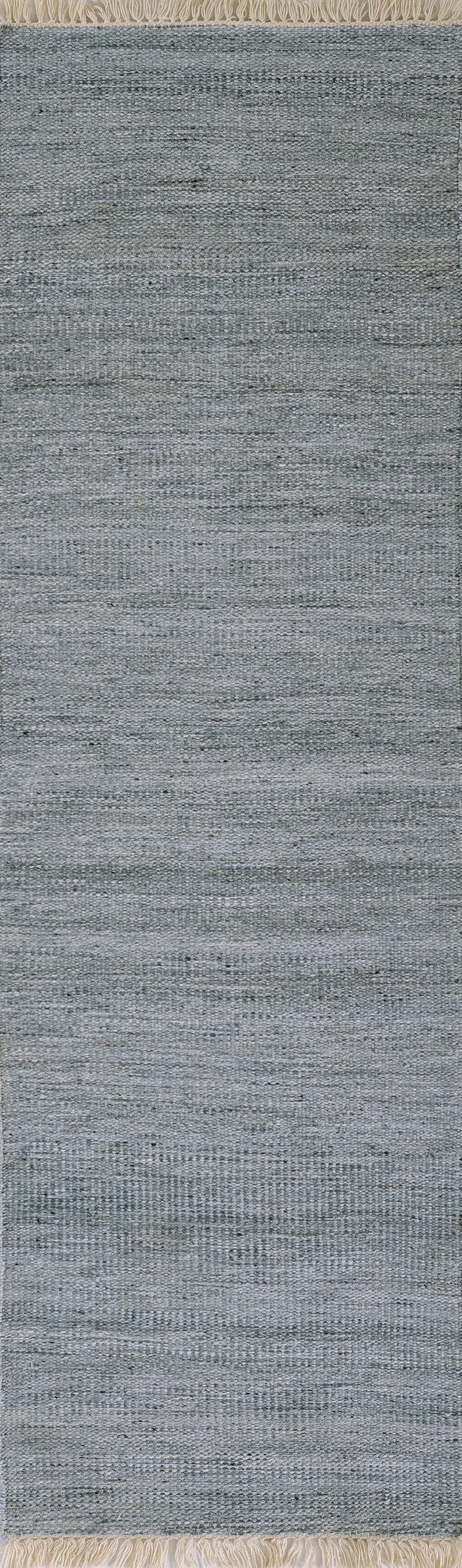 Blue-gray woven area rug with subtle heather texture and beige fringe along the top edge.
