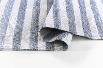 Blue & white striped woven cotton throw blanket with folded edge.