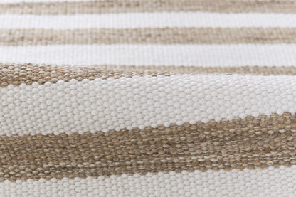 Beige and white striped woven rug with chunky natural-fiber texture.