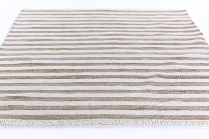 Rectangular flat-weave runner rug with brown and white horizontal stripes and fringe, 2' x 8'.