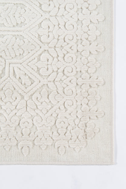 Cream ivory rug with raised geometric and floral motif; textured rectangle for living room decor.