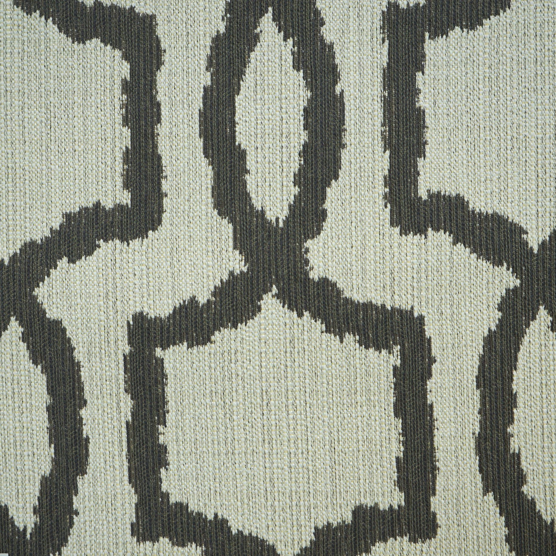 Beige fabric with a dark charcoal geometric lattice pattern; textured woven textile in a modern Scandinavian style.