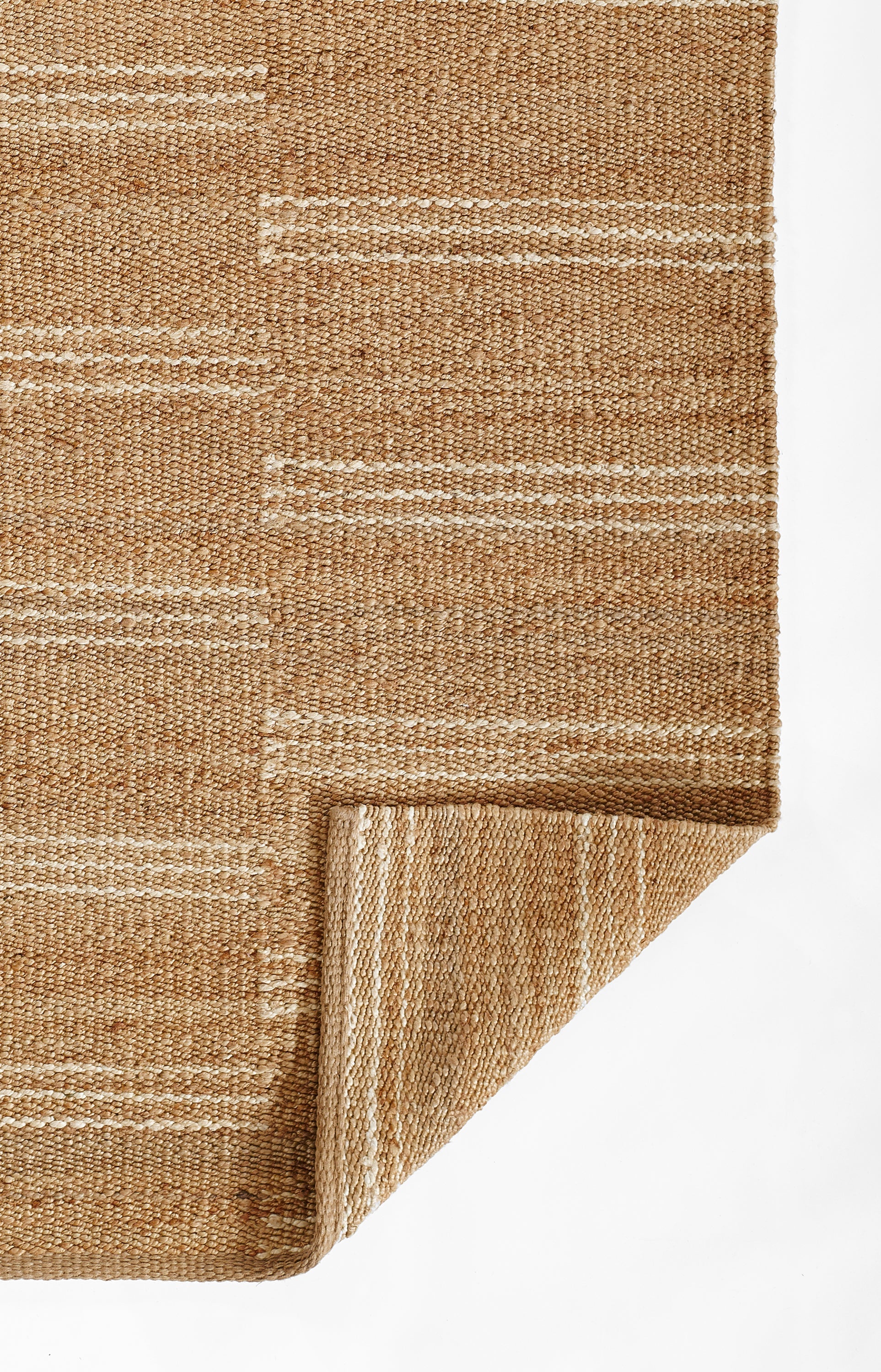 Natural beige woven jute runner with broken white stripes, folded corner.