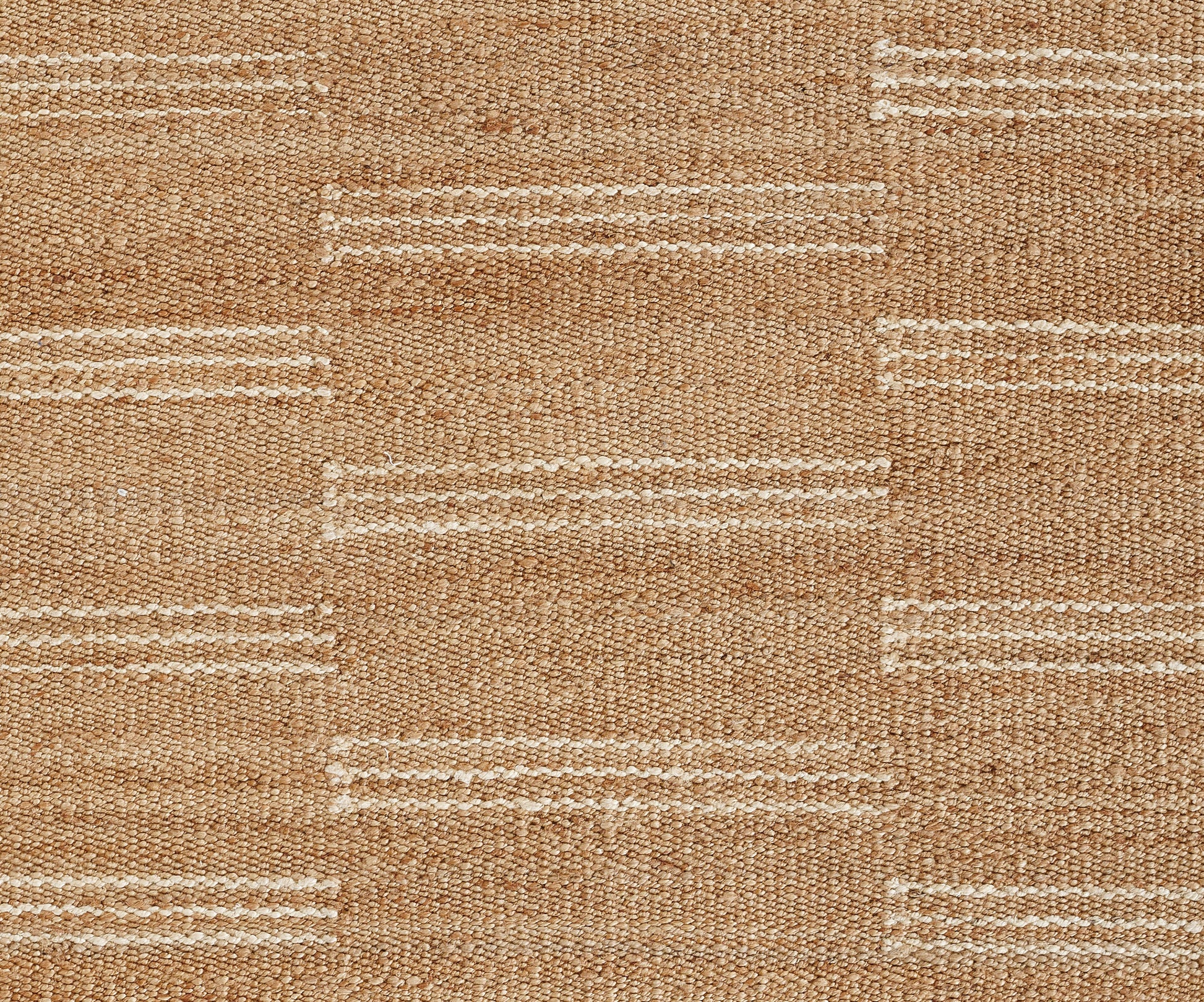 Natural beige woven rug with white horizontal stripes; jute/sisal texture, geometric blocks for rustic living room decor.