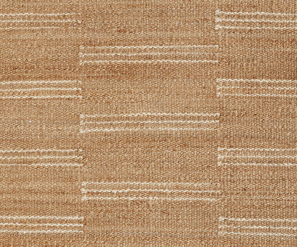 Natural jute rug with a broken cream stripe motif and woven rectangular blocks, rustic casual style.