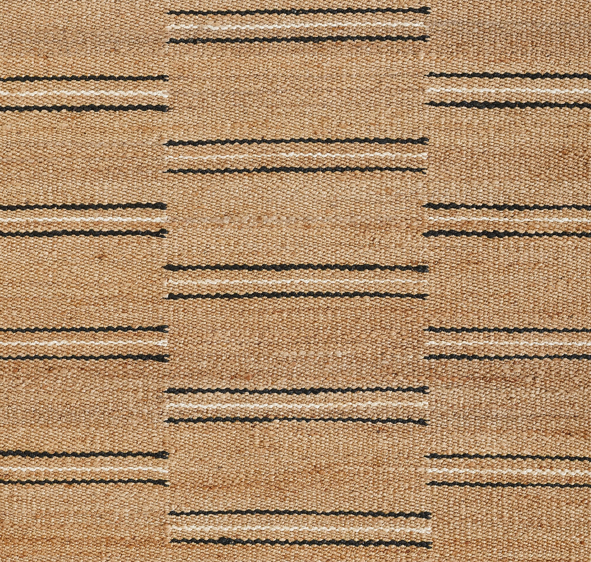 Natural beige jute rug with black horizontal stripe bands forming a subtle grid pattern.
