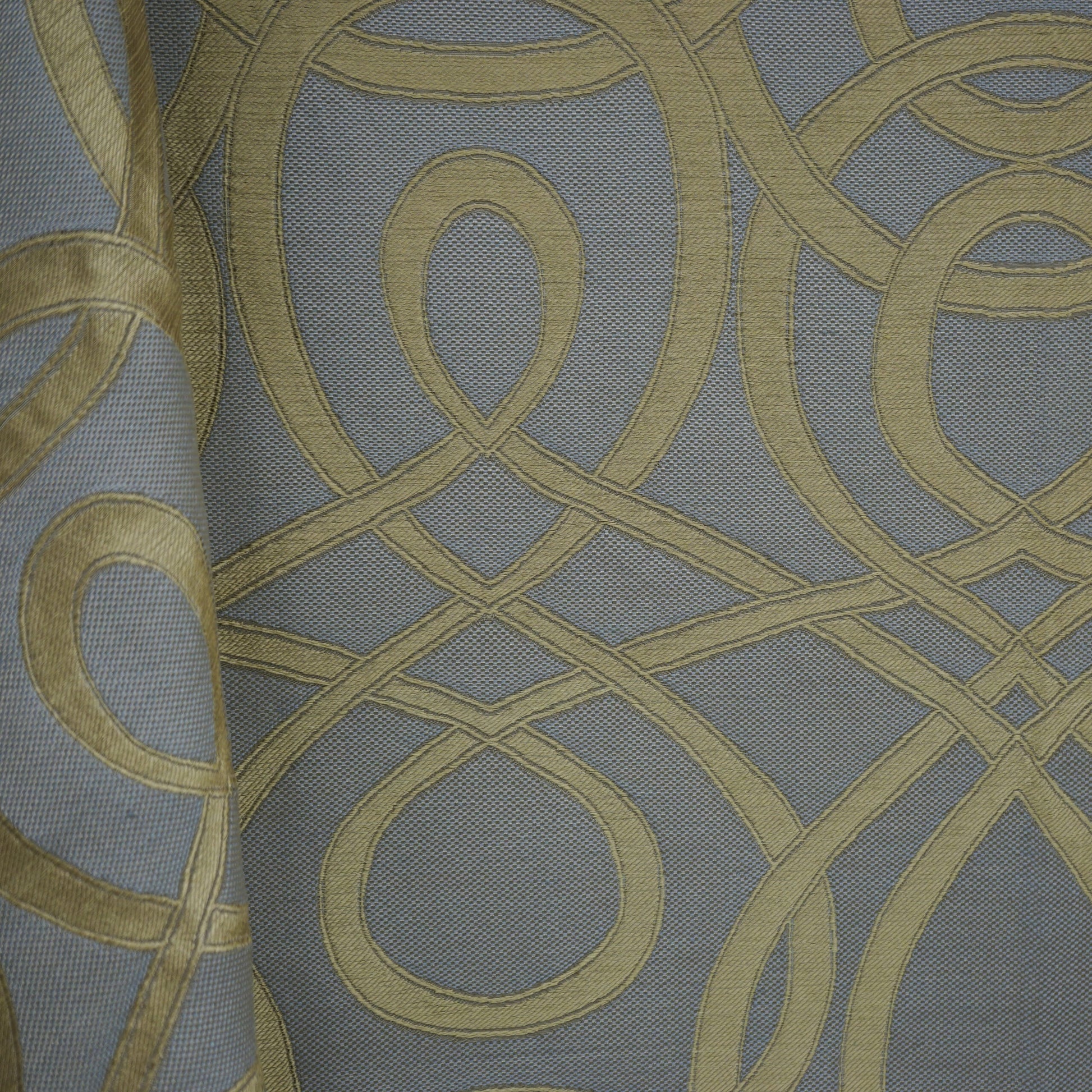 Grey-blue upholstery fabric with gold looping scroll pattern; jacquard weave, decorative for furniture or drapery.