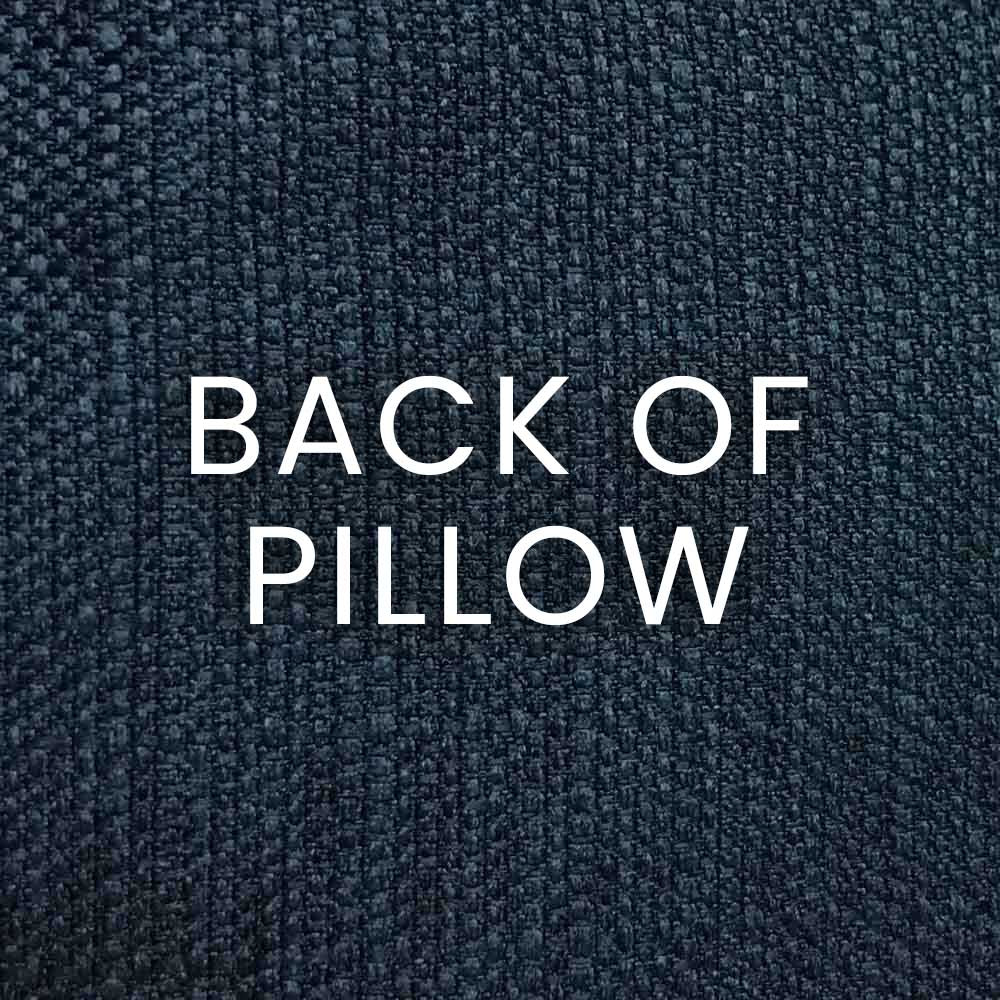Navy woven pillow back with white 'BACK OF PILLOW' text on textured fabric.