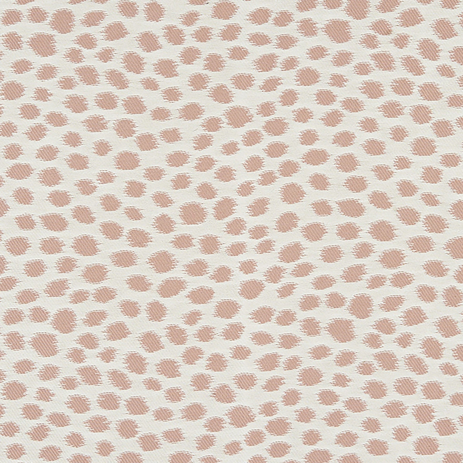 Dalmatian-print fabric with soft pink brush-stroke spots on cream background.
