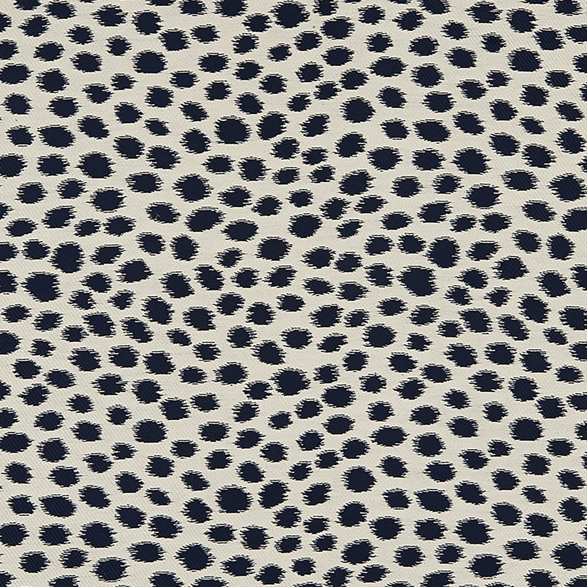 Beige woven fabric with navy Dalmatian spots.
