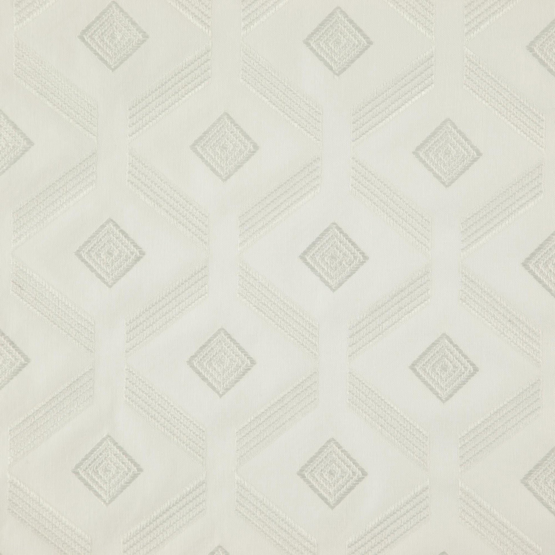 Off-white fabric with white embroidery forming a diamond geometric pattern and a subtle textured surface.