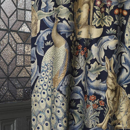 Morris & Co Forest Indigo fabric 85% viscose 15% linen with tapestry-inspired botanical, bird, and animal motifs — perfect for upholstery, curtains, and decorative home projects.