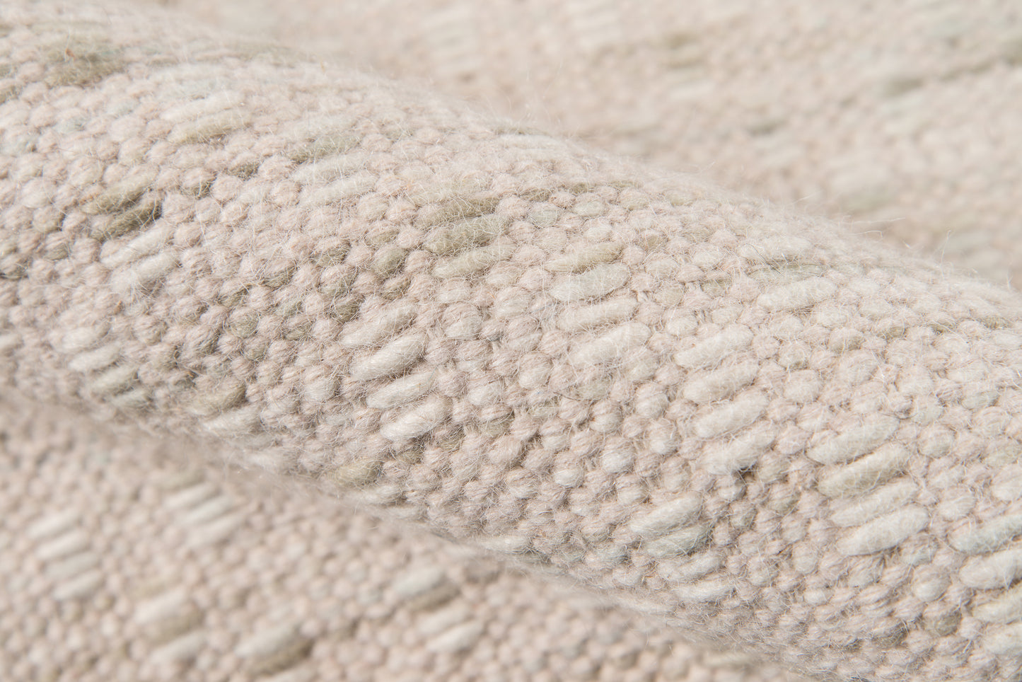 Beige boucle rug close-up with plush loop texture.