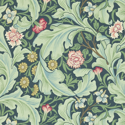 Morris & Co. Leicester Wallpaper in Woad/Sage featuring elegant arching leaves and mid-scale floral blooms designed by John Henry Dearle in 1912. Inspired by the Bachelors Button pattern, this Arts & Crafts designer wallpaper is ideal for feature walls, living rooms, bedrooms, dining rooms, hallways, English cottage, traditional, vintage, and heritage-inspired interiors.