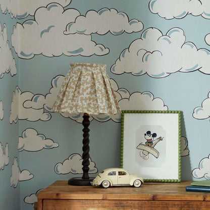 Disney Home x Sanderson Mickey in the Clouds wallpaper mural featuring Mickey Mouse flying through soft pastel clouds and airplanes in a whimsical vintage sky design. Classic Disney nursery wallpaper ideal for kids bedrooms, playrooms, and Disney themed interiors. Dreamy cloud wallpaper mural perfect for nursery décor, feature walls, children’s room design, and vintage Disney home styling.