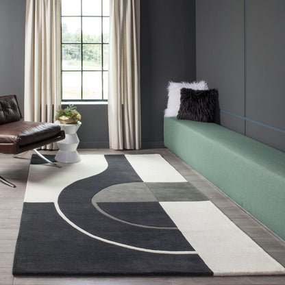 Modern living room featuring an 8' x 10' black-white-gray geometric rug, a green bench, a brown leather chair, and beige curtains.