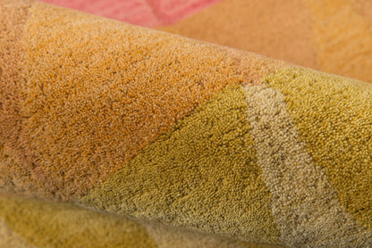 Close-up of rolled multicolor runner rug with tufted pile in orange, yellow, lime, and beige