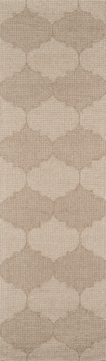Beige woven-textured rug with a repeating trellis/quatrefoil pattern.