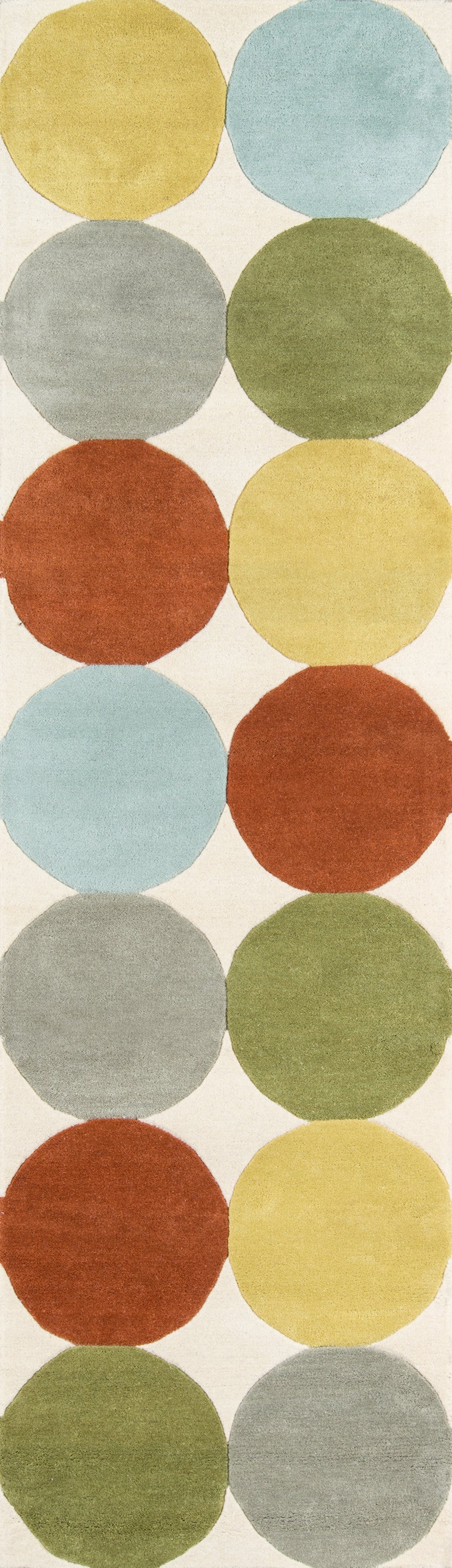Two-column circular print on beige rug; colors include mustard yellow, pale blue, gray, olive green, burnt orange & pale yellow.