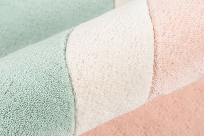 Pastel-striped rug in mint, cream, and peach, 4' x 6'.