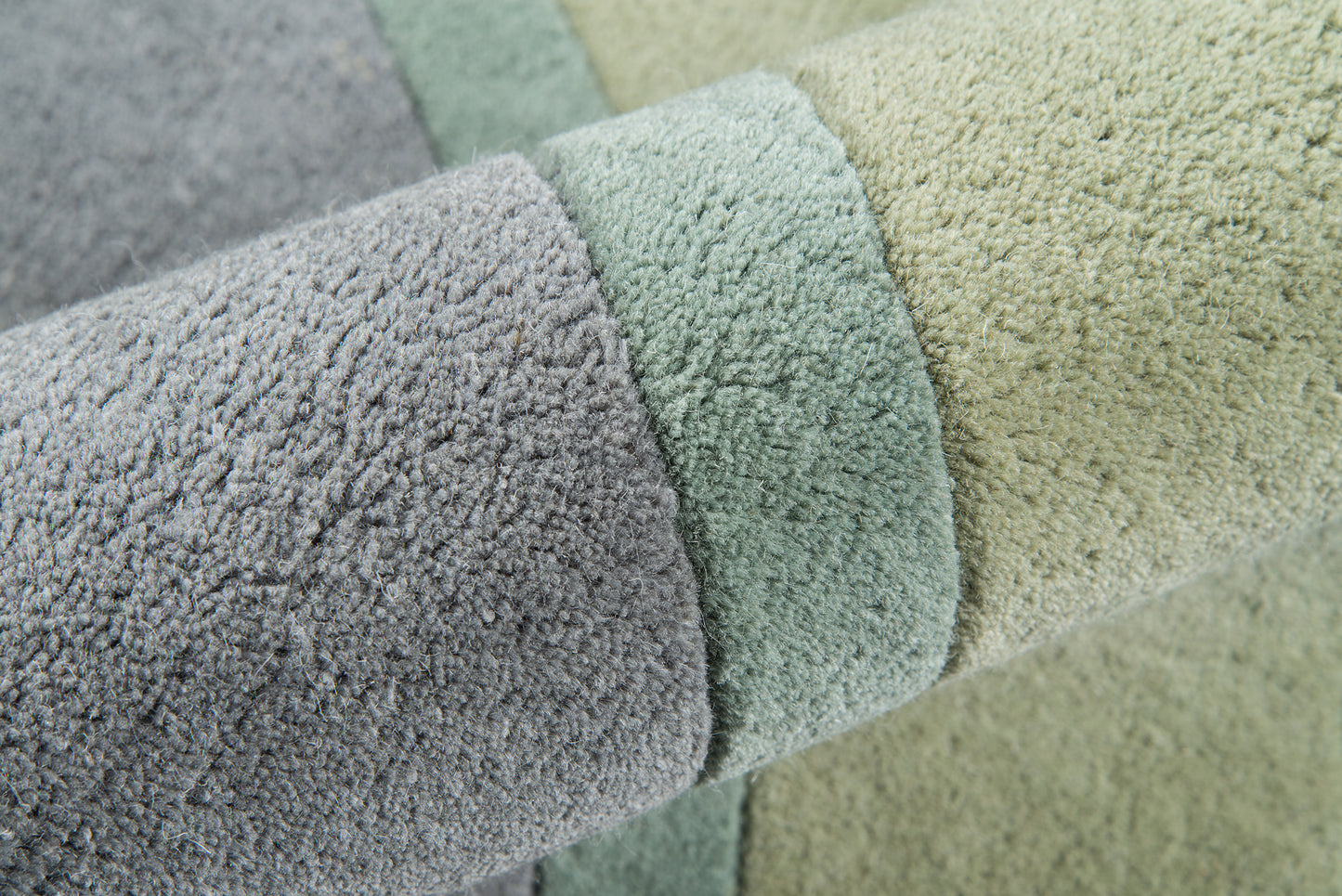 Pastel shaggy rug in lavender, mint, and pale yellow with soft textured pile.