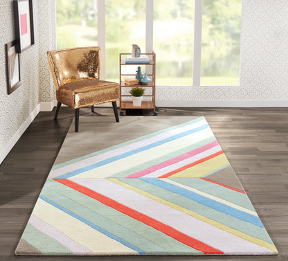 Pastel diagonal-striped rug on dark wood floor, gold sequin chair and light wood rolling cart in a modern living room.