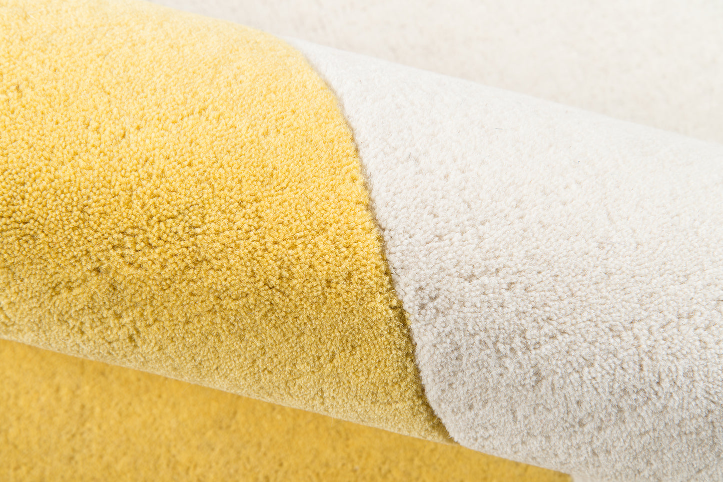 Yellow and cream rug with plush texture, 5' x 8'.