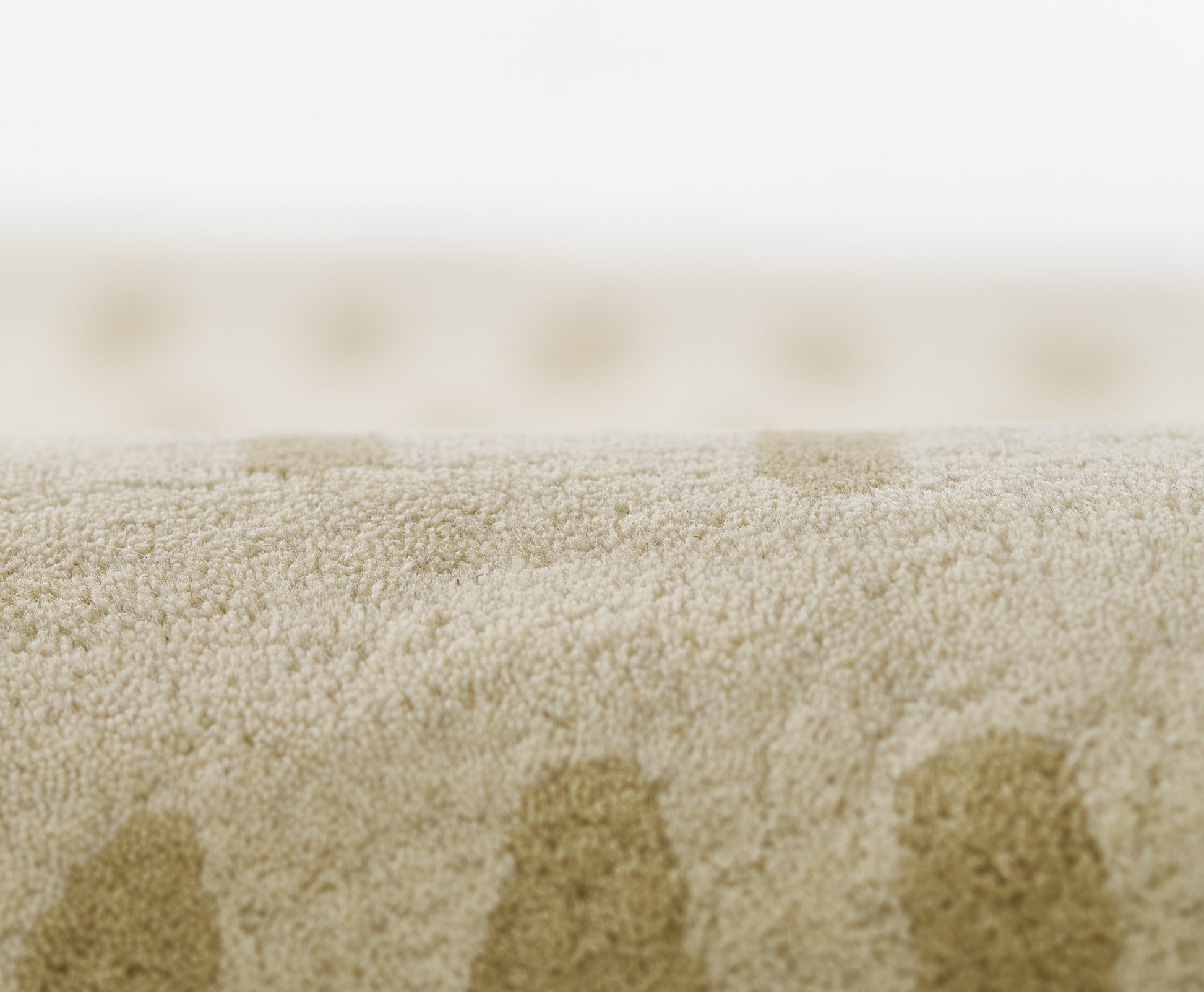 Beige 2' x 8' rug runner close-up showing soft looped-pile fabric with a subtle dotted pattern.