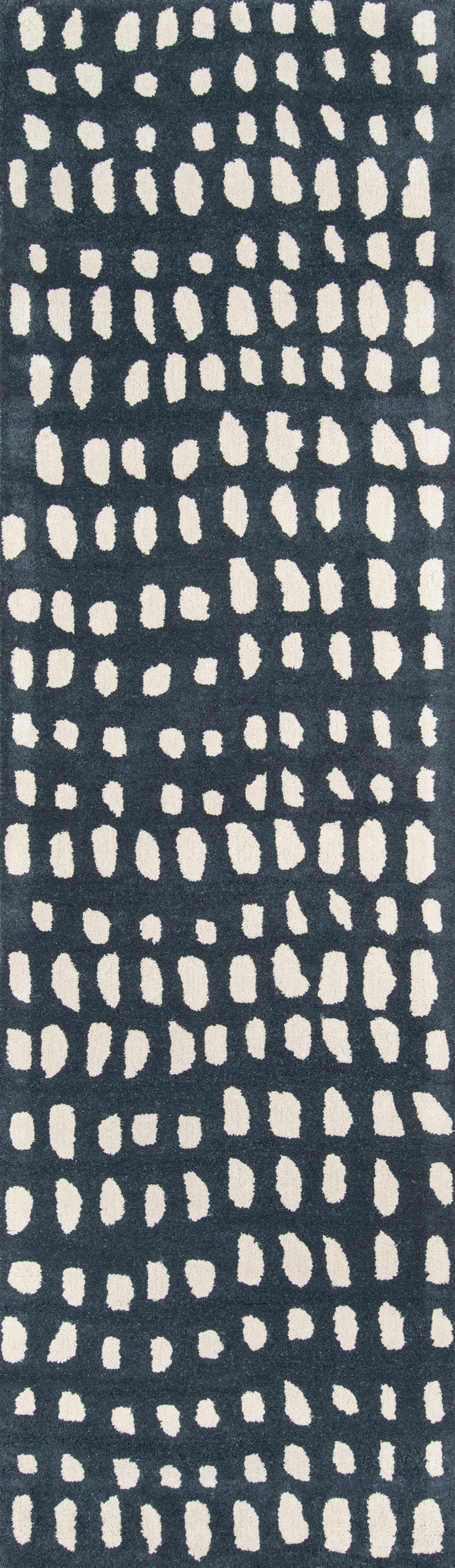 Dark navy rug runner with cream irregular dot pattern in vertical columns.