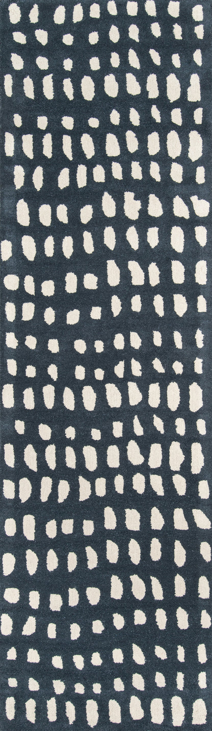 Dark navy rug runner with cream irregular dot pattern in vertical columns.