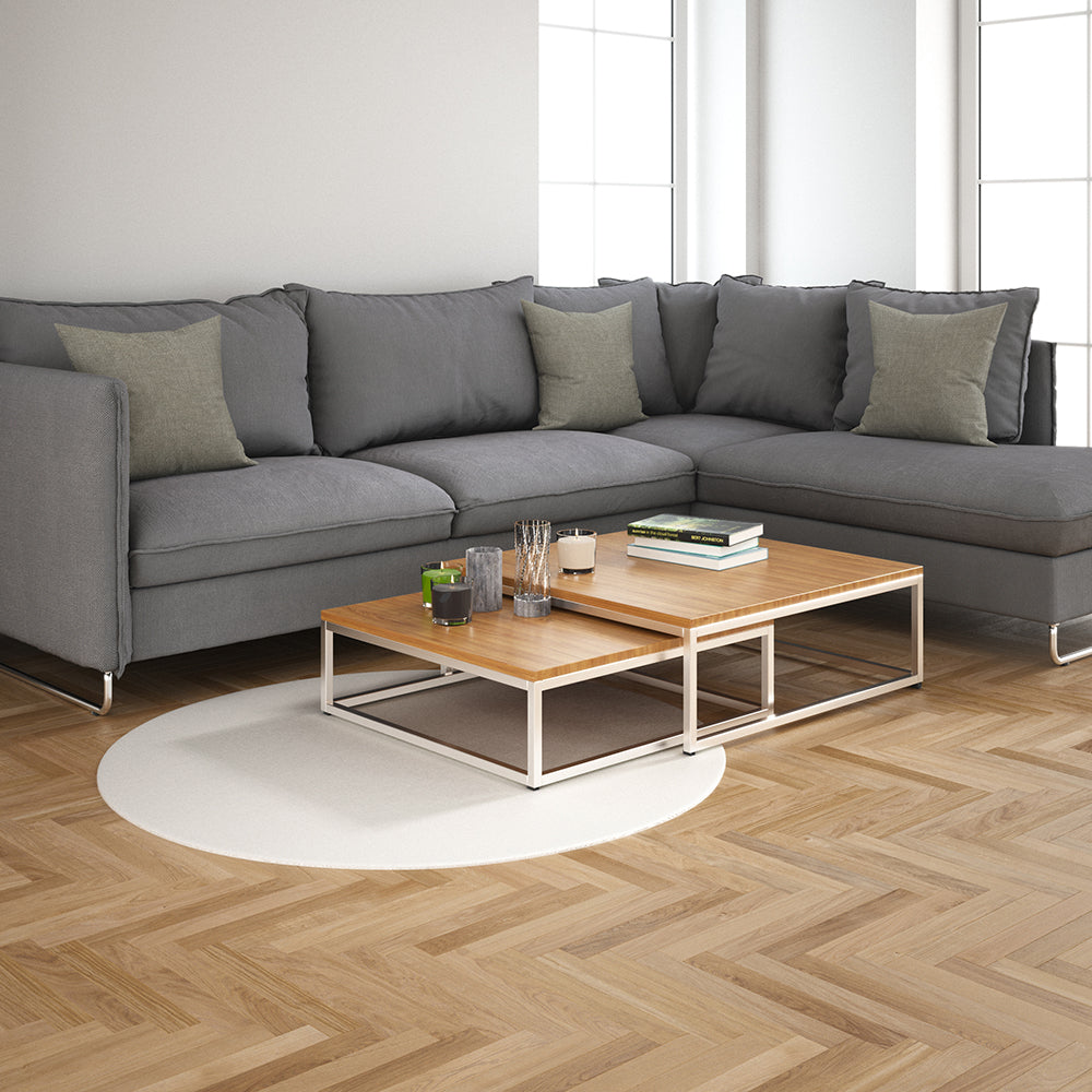 Pewter solid fabric swatch with visible texture in a modern living room setting.
