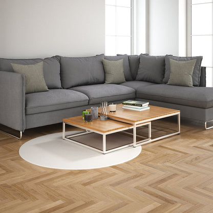 Pewter solid fabric swatch with visible texture in a modern living room setting.