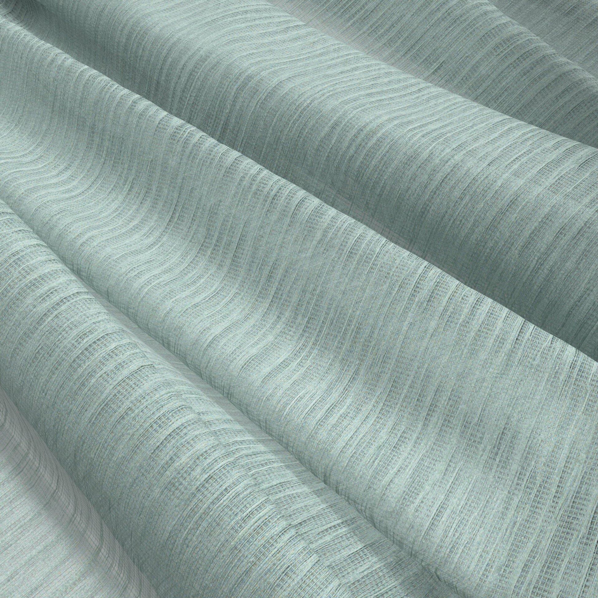 Mint green crinkled sheer fabric with a subtle ribbed texture, gracefully draped; linen-like material for curtains or apparel.