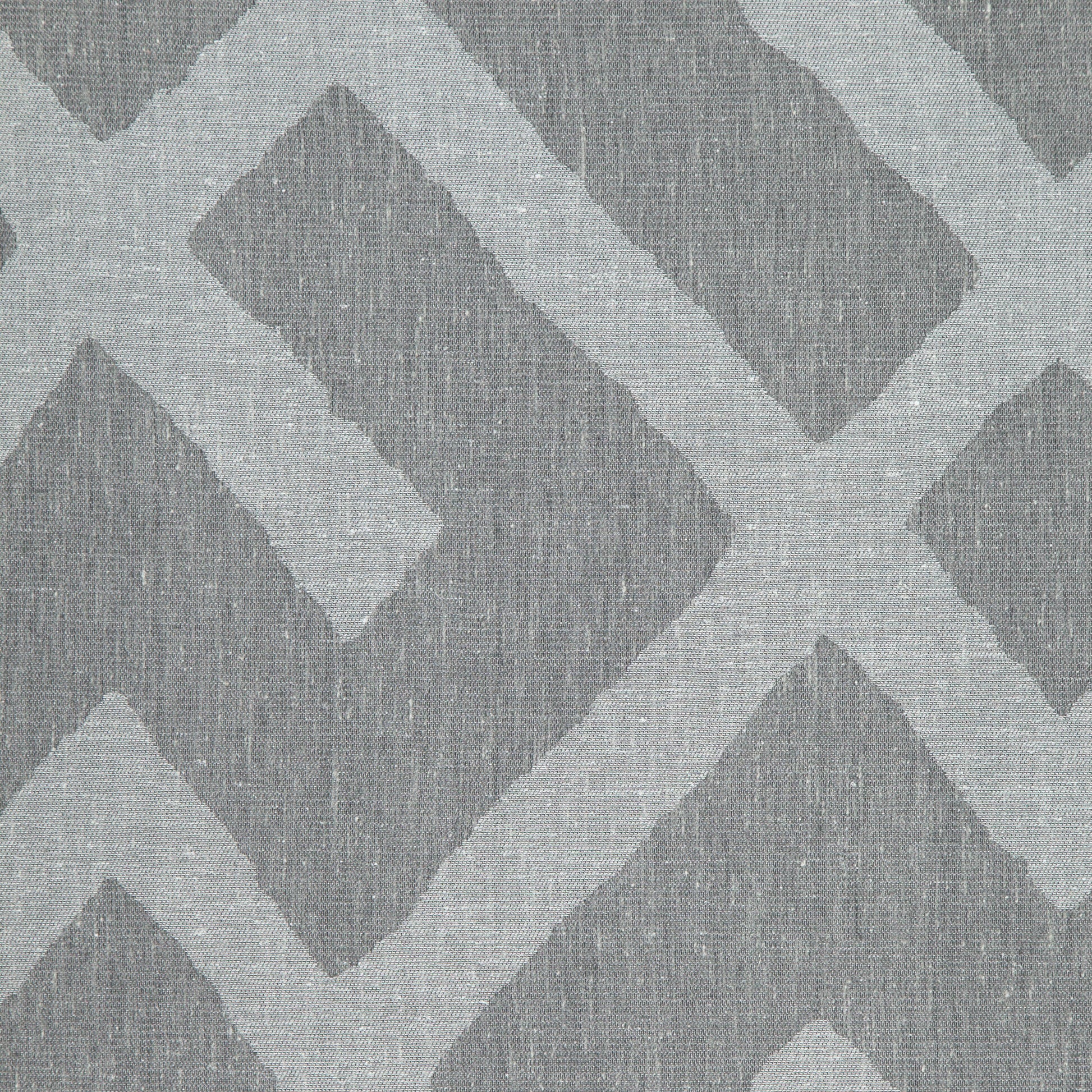 Grey and silver linen jacquard fabric with an interlocking chevron meander geometric pattern.