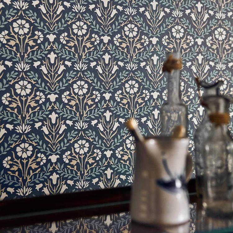 Morris & Co. Morris Bellflowers Wallpaper in Indigo/Linen with a classic interlocking floral pattern inspired by William Morris designs. Ideal for living rooms, bedrooms, hallways, and elegant traditional or cottage-style interiors.