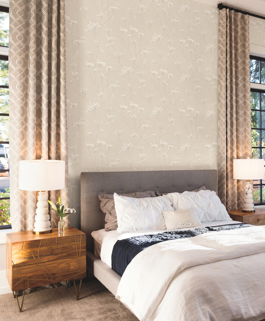 Enchanted Cream Pearl wallpaper by York Wallcoverings, featuring delicate ivory wildflowers and fine taupe stems on a soft cream background for elegant neutral interiors.